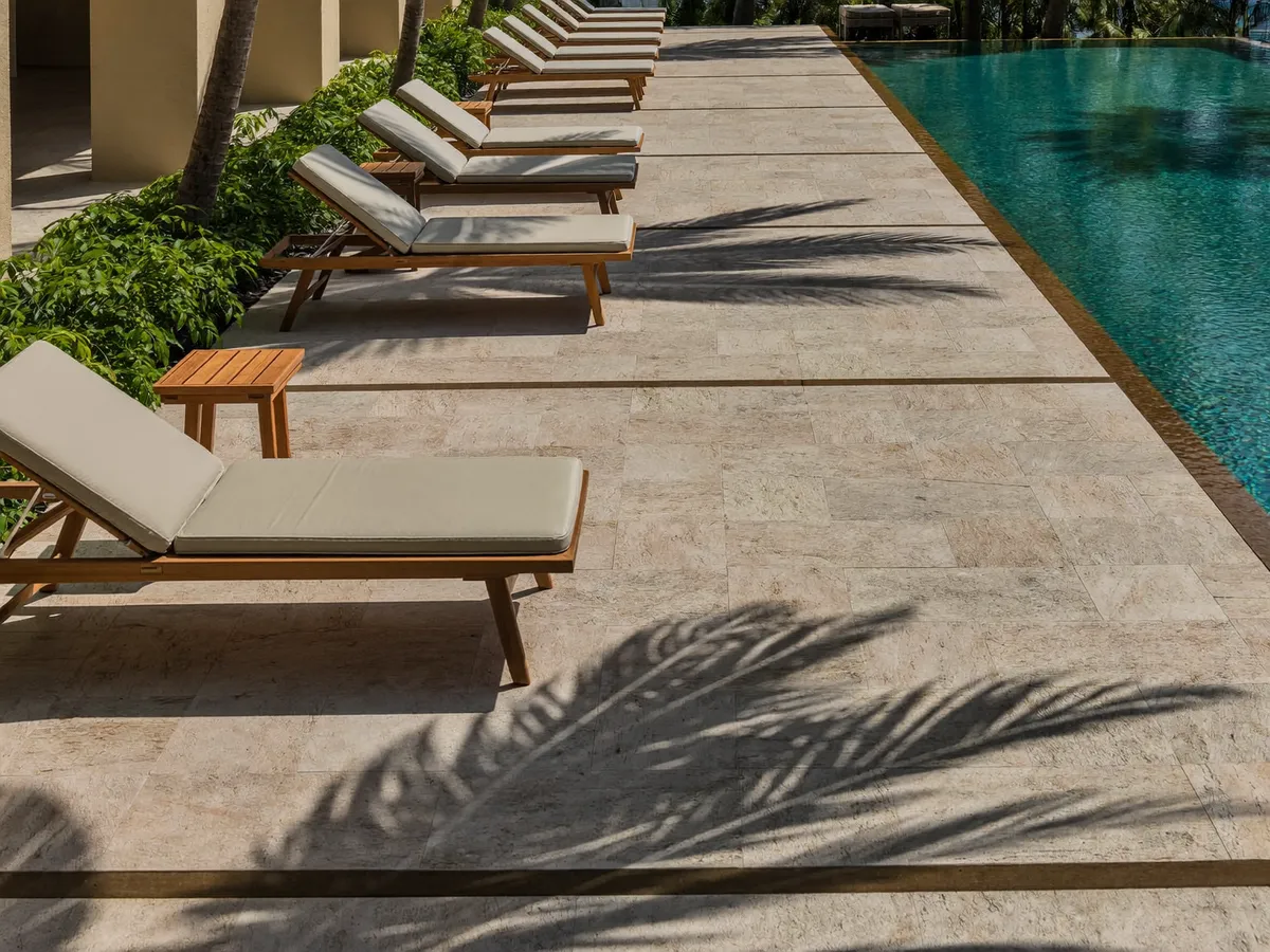 Anti-slip stone tiles on a tropical Bali villa pool terrace