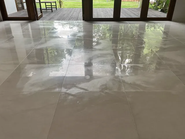 Freshly tiled living room floor with large porcelain tiles in a Bali villa